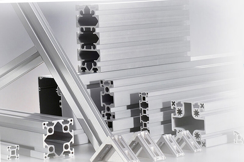 What are the determinants of the production rate of aluminum profiles?